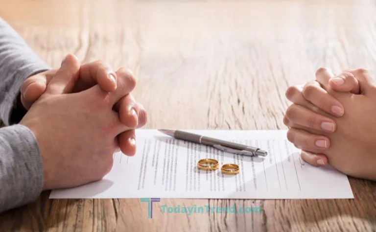 New York divorce papers and wedding rings on a desk