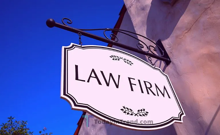 Person checking a law firm's details online before hiring