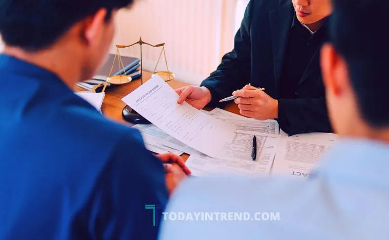 Client meeting with a lawyer across a desk to discuss ending the representation