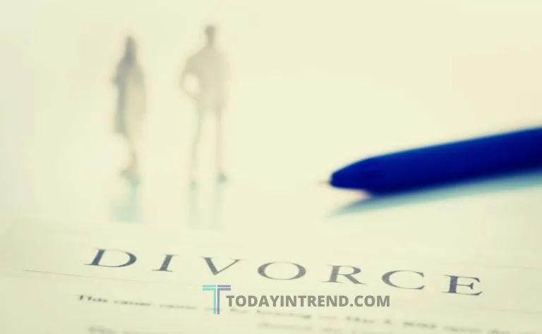 Calculator, cash and divorce papers on a table