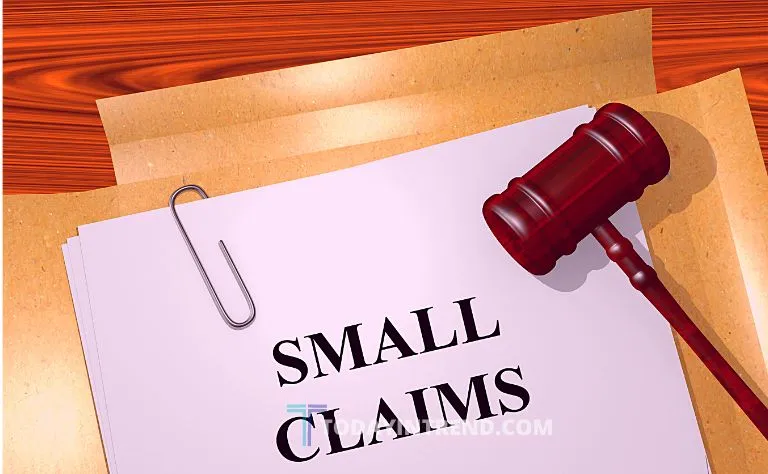 Small claims court papers and a gavel on a desk