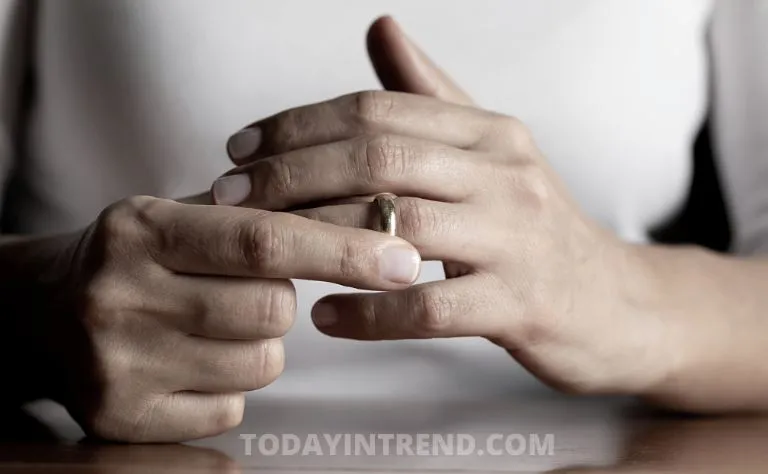 Divorce papers and wedding rings on a table