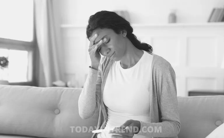 Woman reading a pregnancy test at home