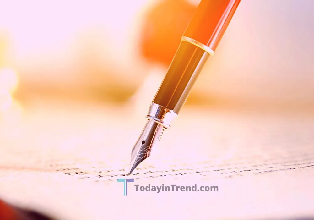 Tax documents, a calculator and a pen on a desk